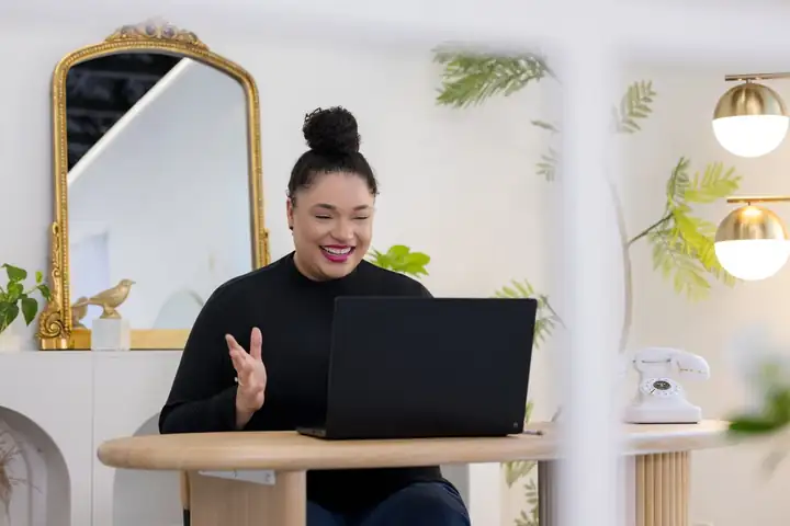 Jillian smiling at her desk